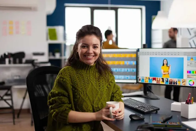 Woman Retoucher Looking Camera Smiling Sitting Creative Media Agency Retouching Client Photos Pc With Two Displays X - Adobe Certified Professional study guide