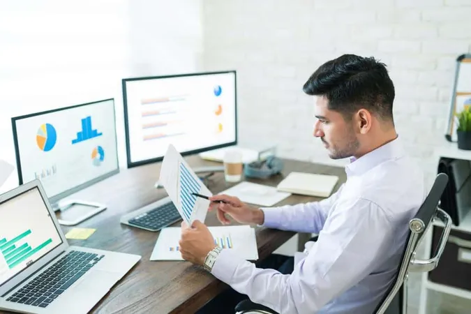 Handsome Latin Businessman Examining Sales Data While Working Home X - Audit Data Analytics Certification study guide