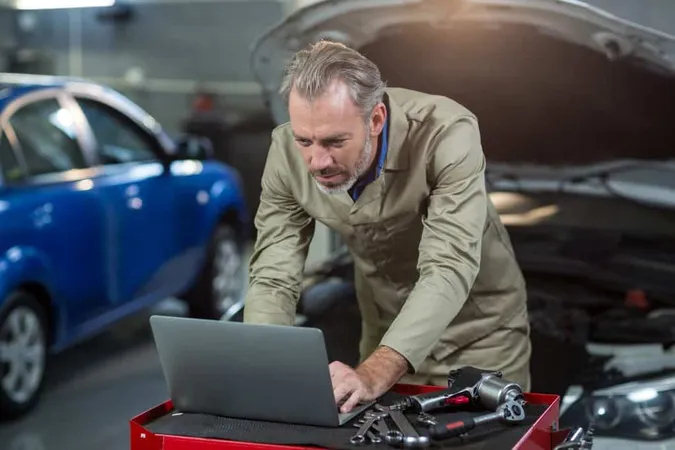 Mechanic Using Laptop X - Audi Diagnostic Technician study guide