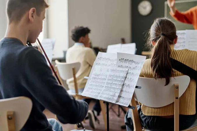 Teenagers Playing School Orchestra X - Australian Music Examinations Board Grade 2 Theory study guide