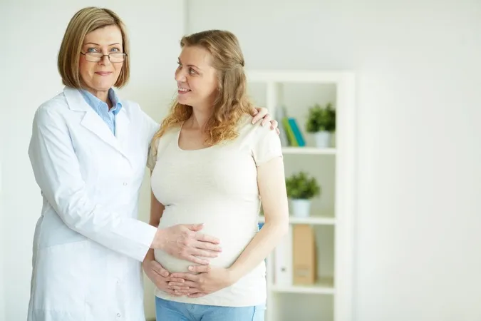 Doctor Touching Belly Her Patient X - American Board of Obstetrics & Gynecology study guide
