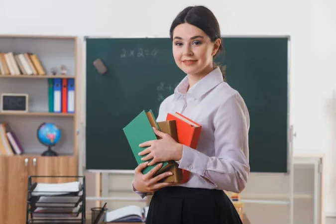 Smiling Holding Books Young Teacher Standing Front Blackboard Classroom X - Certified Advanced Placement Teacher study guide