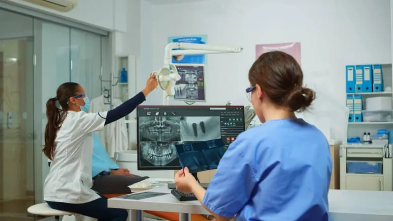 Stomatologist Nurse Comparing Radiographics Looking Computer While Specialist Doctor With Face Mask Speaks Man With Toothache Sitting Stomatological Chair Preparing Tools Surgery X - American Society for Health Care Engineering Certified study guide