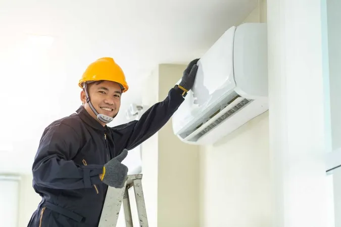 Male Technician Repairing Air Conditioner Safety Uniform Indoors 1 X - American Society of Heating, Refrigeration and Air Conditioning Engineers Certification study guide
