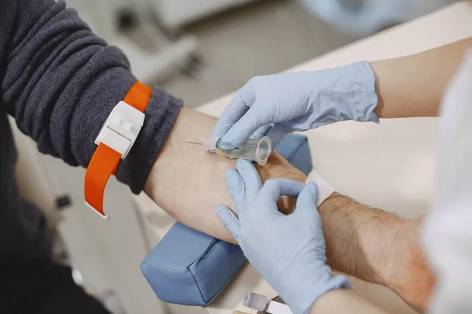 Skillful Nurse Is Doing Blood Test Man Clinic Man Medical Mask X - American Society of Phlebotomy Technicians study guide