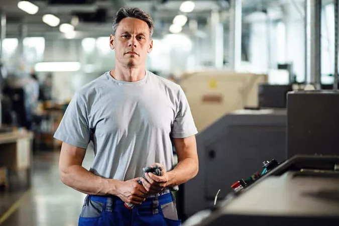 Portrait Cnc Machine Machine Operator Standing Factory Looking Camera - Accredited Tier Professional Certification (Cooling & Refrigeration) study guide
