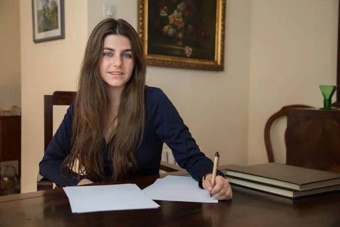 Young Woman Writing Blank Sheet With Pen X - Arizona Bar Exam study guide