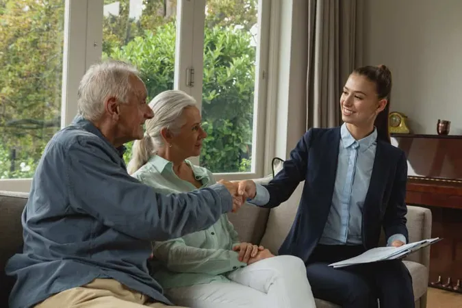 Active Senior Man Shaking Hands With Real Estate Agent Living Room X - Certified Application Counselor study guide