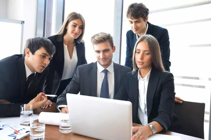 Startup Business Team Meeting Modern Bright Office Interior Brainstorming Working Laptop Tablet Computer X - Certified Blockchain Consultant study guide