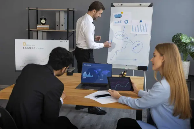 Business Person Looking Finance Graphs 1 - Certified Cryptocurrency Expert study guide