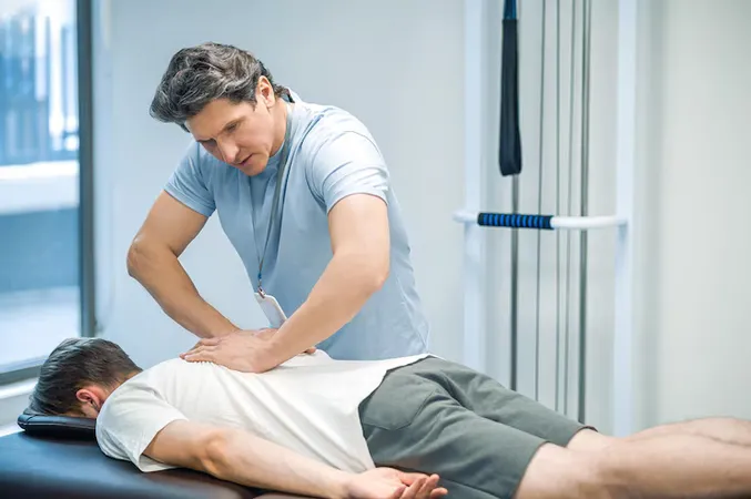 Back Massage Male Patient Having Session Rehabilitation Back Massage - Certified Chiropractic Sports Physician study guide