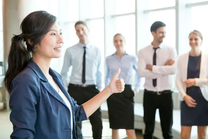 Successful Asian Lady Showing Thumb Up X - Certified Executive Leadership Coach study guide