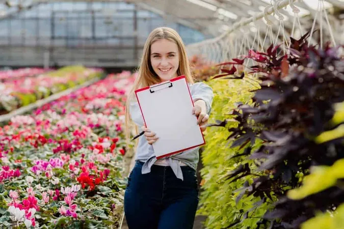 Front View Woman Showing Clipboard 23 X - CH (Certified Horticulturist) study guide