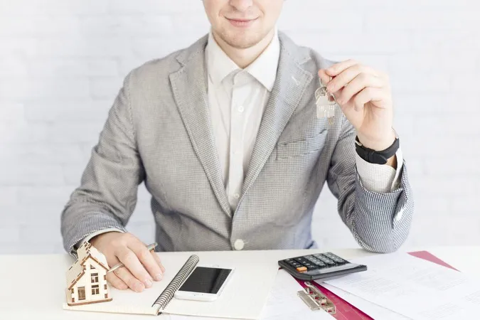 Smiling Agent Giving Keys X - Certified Mortgage Processor study guide