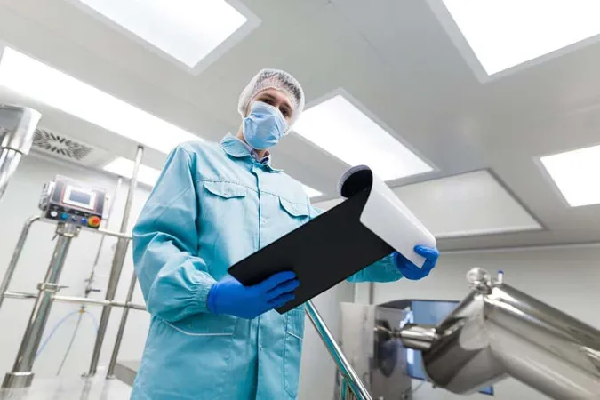Close Look Scientist Blue Lab Suit Stand Metal Chromed Stairs Laboratory Look Tablet From Bellow - Certified Mortuary Technician study guide
