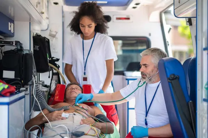 Paramedics Examining Unconscious Man Medical Emergency Vehicle X - Community Paramedic Certification study guide