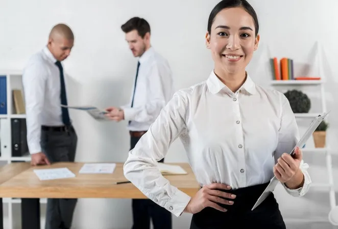 Confident Smiling Young Businesswoman Holding Clipboard Hand With Two Businessman Standing Backdrop X - Certified Professional Manager study guide
