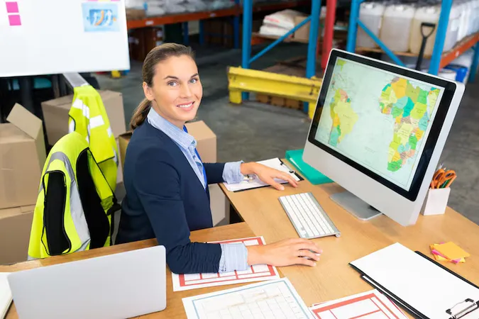 Female Manager Working Computer Desk Warehouse - Certified Professional in Supply Management study guide