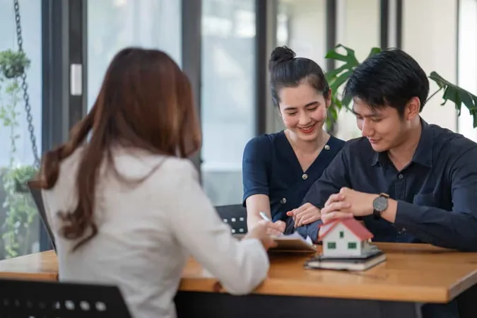 Happy Married Diverse Couple Signing Contract Making Legal Deal Taking Loan Mortgage Purchasing Real Estate New Apartment X - Commercial Real Estate Certification Institute study guide