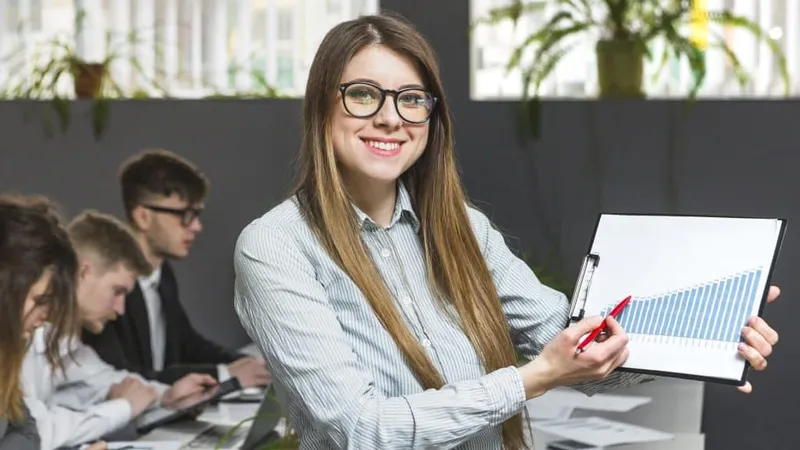 Portrait Happy Businesswoman Showing Graph X - Certified Sales Trainer study guide
