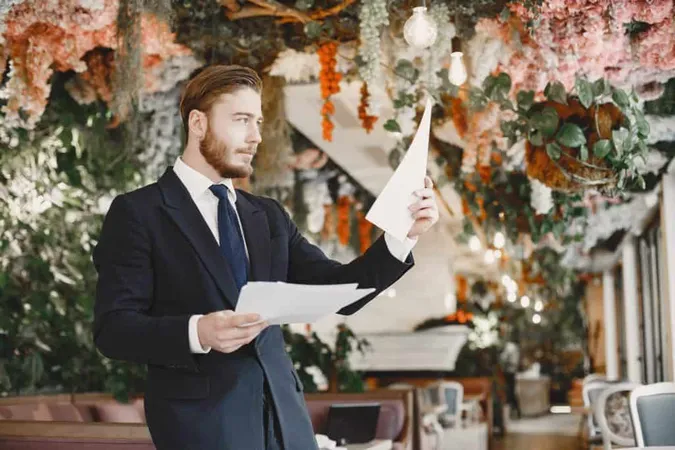 Guy Black Suit Male Restaurant X - Certified Venue Executive study guide