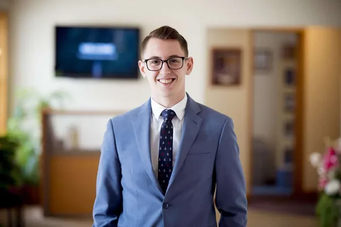 Portrait Man With Glasses Blue Suit With Tie Lights With Blurry Background X - Massachusetts Notary Exam study guide