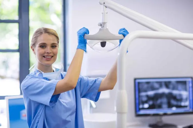 Portrait Female Nurse Adjusting Dental Light X - National Dental Assisting Examination Board study guide