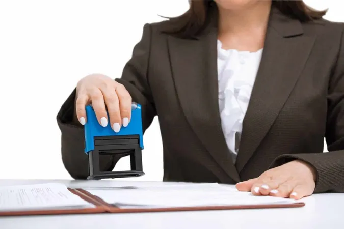 Businesswoman Putting Stamp Documents Isolated White Background X - National Notary Association Certification study guide