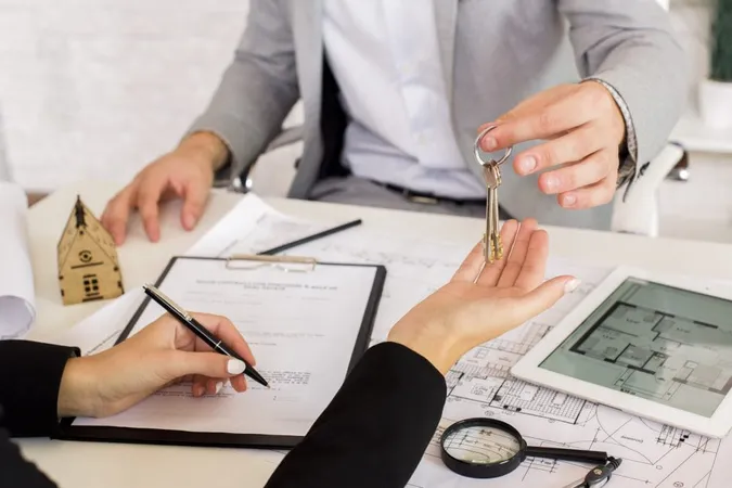 Real Estate Broker Agent Presenting Consult Customer Decision Making Sign Insurance Form Agreement Home Model Concerning Mortgage Loan Offer Office X - Real Estate Asset Management Certification study guide