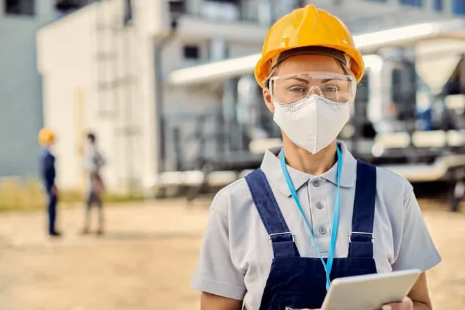 Female Building Contractor With Digital Tablet Wearing Face Mask Construction Site X - Safety and Health Specialist Certificate study guide