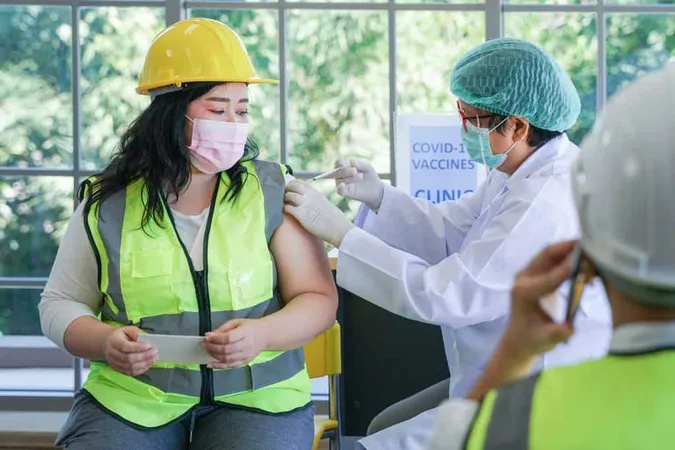 Worker Man Sitting Getting Covid Vaccine With Nurse Injecting Vaccine Get Immunity X - Safety and Health Specialist Certificate study guide